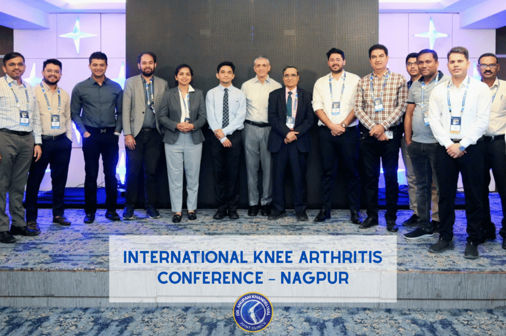 Dr Anupam Khandelwal at international knee arthritis conference Nagpur with orthopedic surgeons discussing knee arthritis treatment under 55