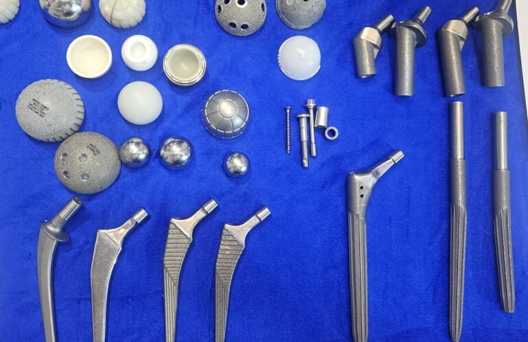 Modern Hip Replacement Cups, femoral stems, ceramic heads, and Total Hip Replacement implants displayed at Current Concepts in Arthroplasty (CCA) 2026, AIIMS New Delhi, showcasing advanced hip replacement implant options available in India.